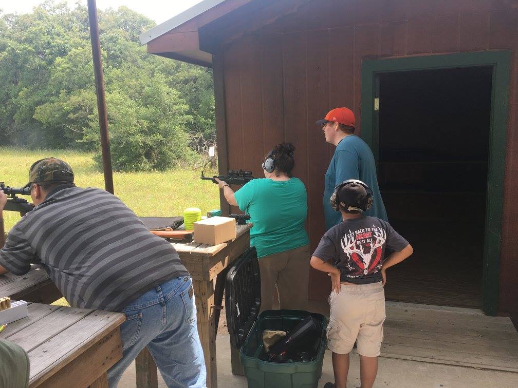 families at outdoor shooting range