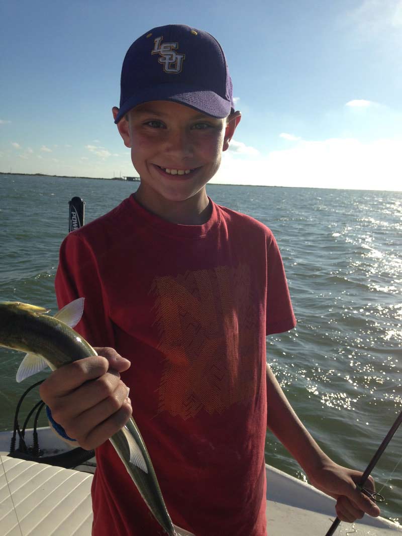 Wooden discs that say hunt with heart and a pile of bullets