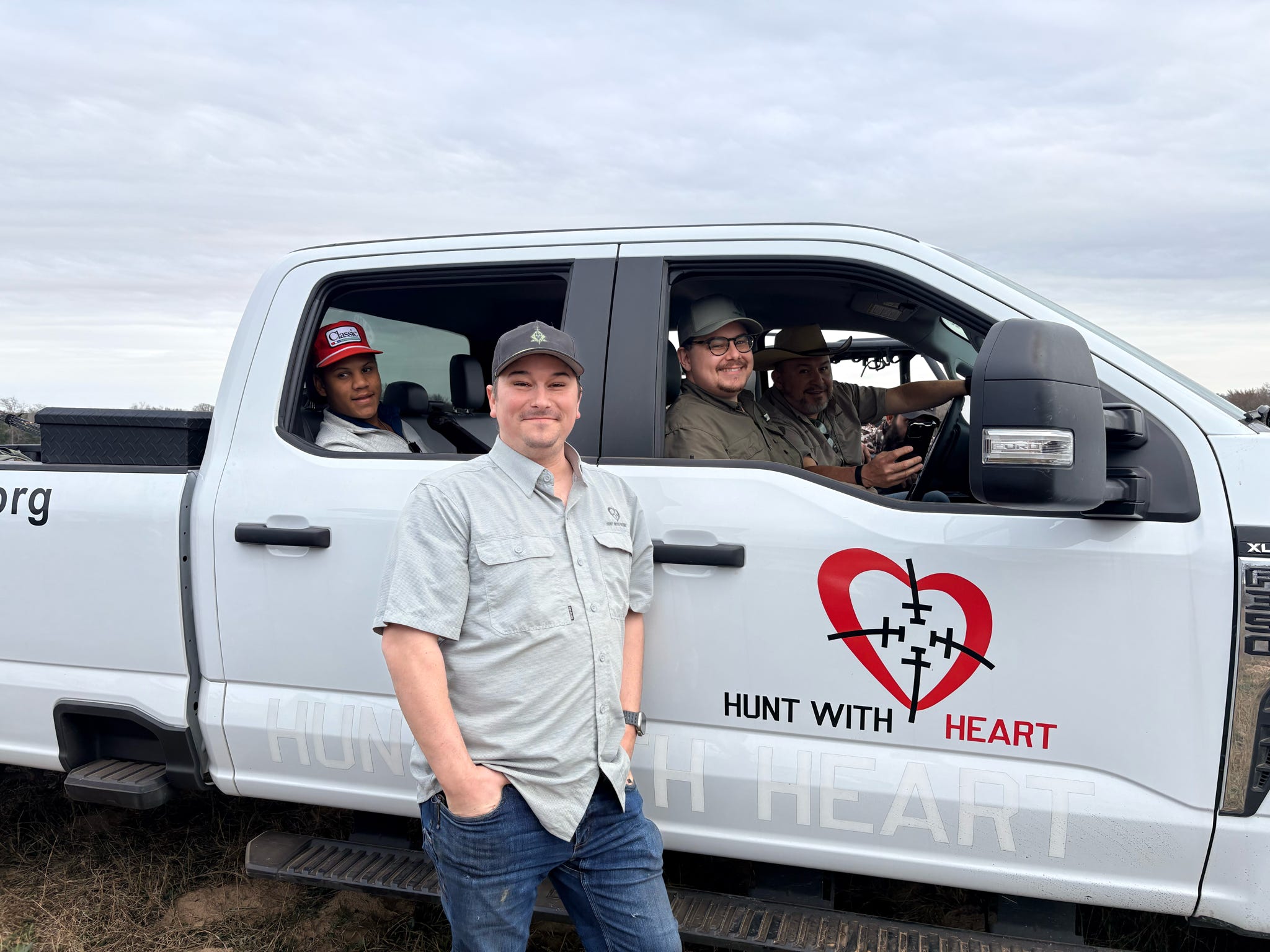 Wooden discs that say hunt with heart and a pile of bullets
